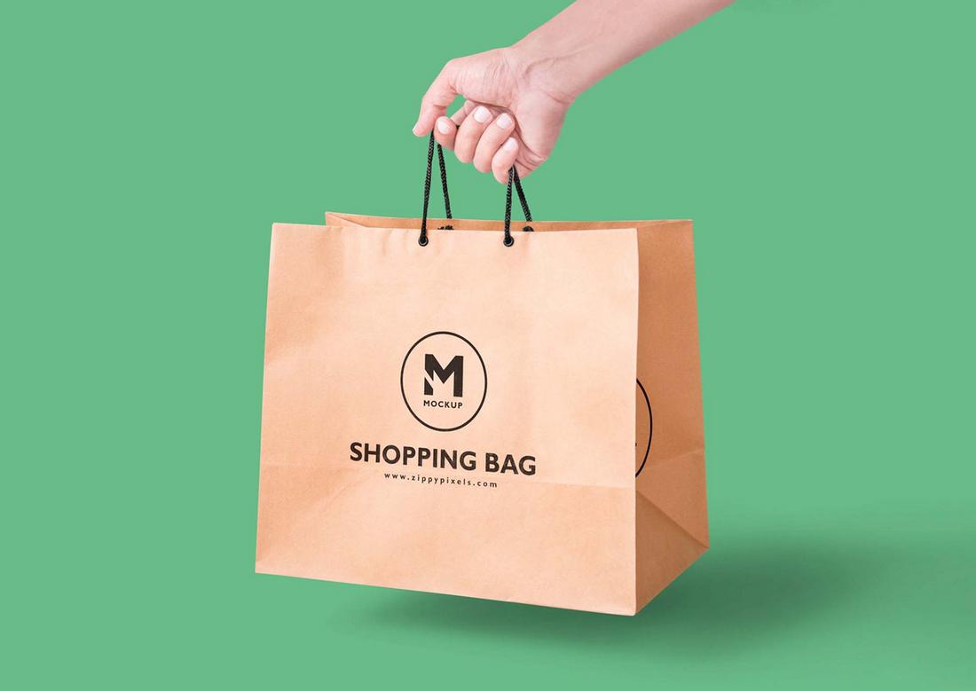 Free Handheld Paper Bag Mockup (PSD)